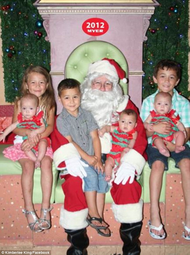 Mrs King's children with Santa Claus. Back from left are Makaya, Taison and Tane, with (at front) triplets Mackenna, Madisyn and Mariyah